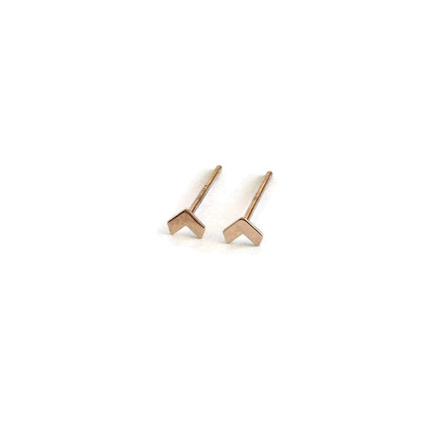 The tiny arrow stud earrings are made of solid 14k gold. The gold arrow earrings are for the earlobes or for cartilage pierced ears.