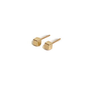 The cube stud earrings made of solid 14k yellow gold with 14k yellow gold ear posts.