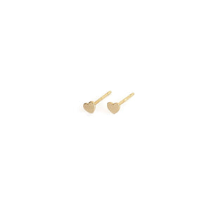 14k gold tiny heart stud earrings are great to layer with other gold earrings