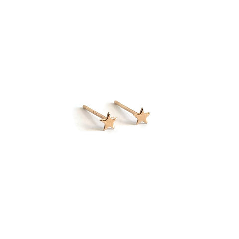 small 14k gold stud earrings feature tiny gold star earrings.
