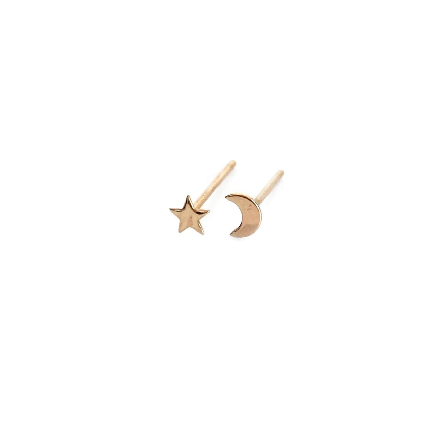 Crescent moon and star stud earrings are made of 14k solid gold.  This mismatched moon and star stud earrings are dainty and small.  You can layer them with other gold stud earrings if you have two piercings ear lobe