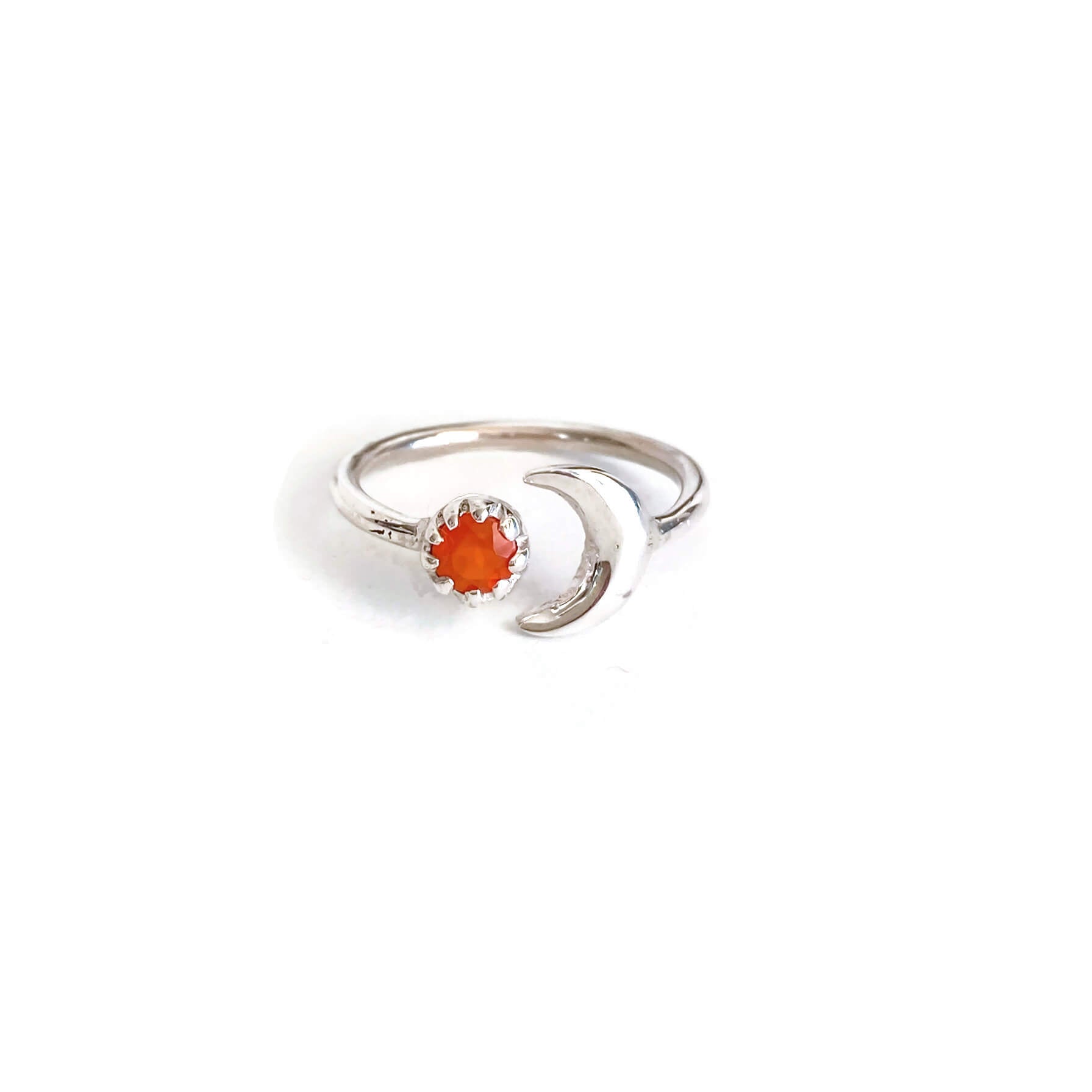 This is a sterling silver carnelian and moon ring. It's made of real carnelian crystal and sterling silver.
