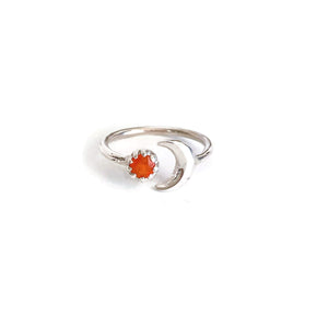 This is a sterling silver carnelian and moon ring. It's made of real carnelian crystal and sterling silver.