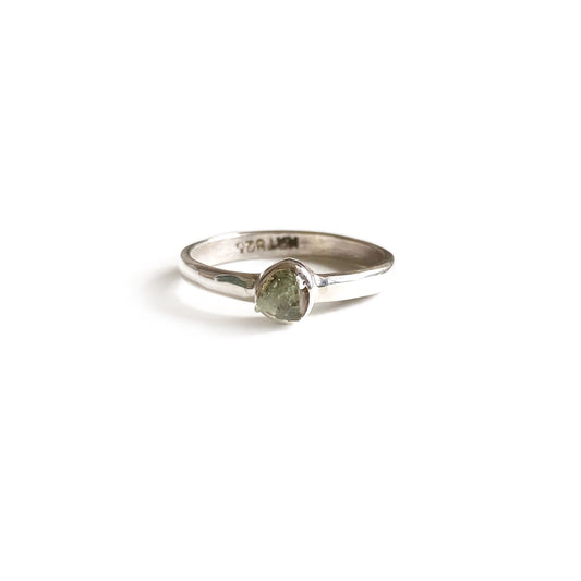 This is a moldavite ring that is made of rough uncut genuine Moldavite with sterling silver