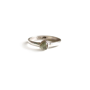 This is a moldavite ring that is made of rough uncut genuine Moldavite with sterling silver 
