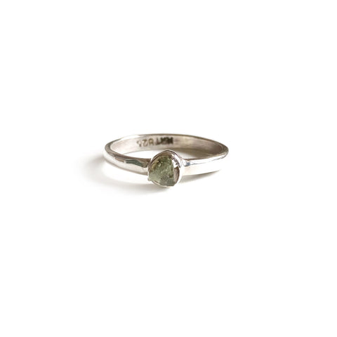 This is a moldavite ring that is made of rough uncut genuine Moldavite with sterling silver 
