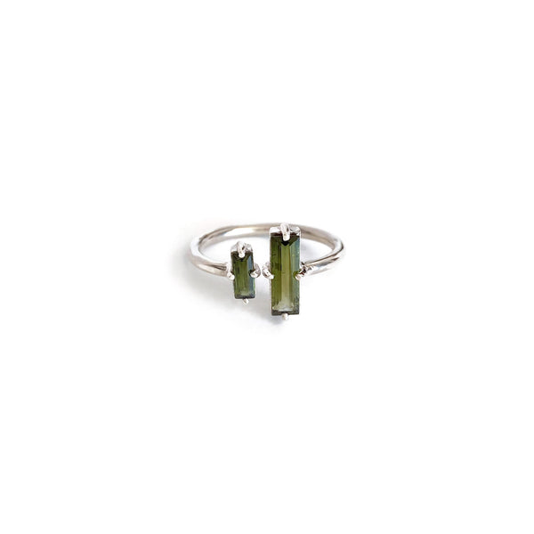 This is a green Tourmaline ring that is adjustable. It's made of genuine green tourmaline and sterling silver. 