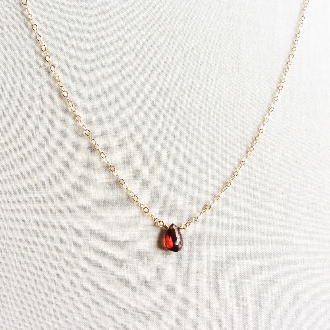 This dainty garnet necklace is made of real garnet and 14k gold chain.  This garnet birthstone necklace can also be made in sterling silver or gold filled chain.