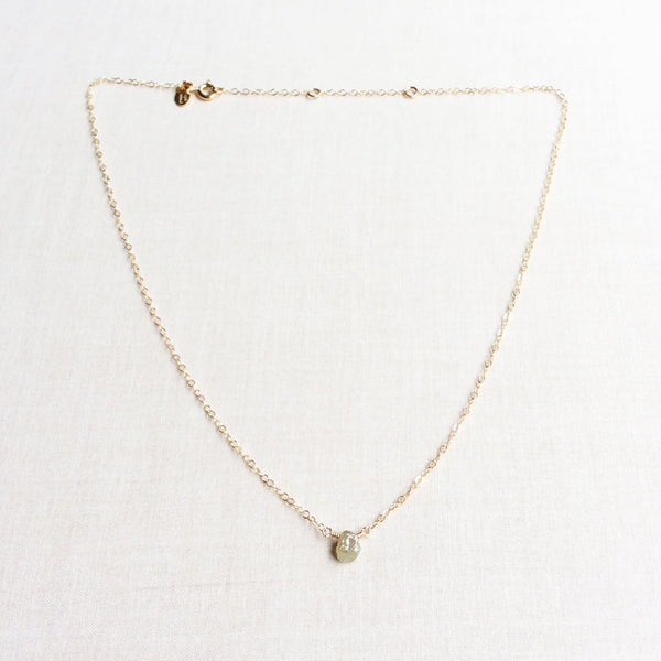 This uncut diamond necklace is simple and dainty. The rough cut diamond necklace is sourced ethically with care. 