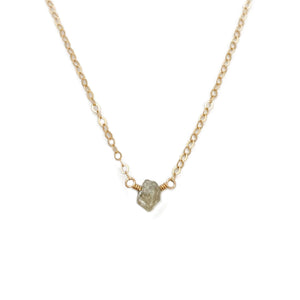 The raw diamond necklace is made of an uncut diamond and 14k gold chain.  This uncut diamond necklace can also be made in gold filled or sterling silver chain.