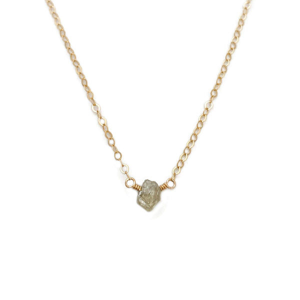 The raw diamond necklace is made of an uncut diamond and 14k gold chain.  This uncut diamond necklace can also be made in gold filled or sterling silver chain.
