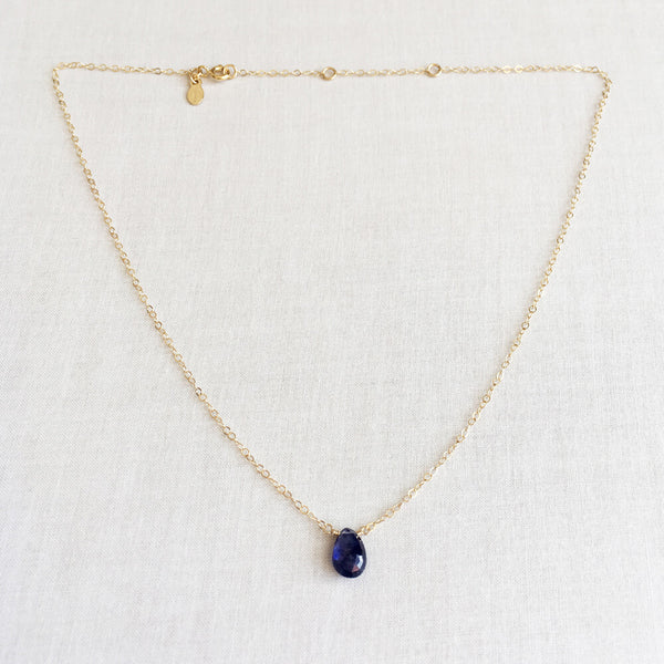This is a dainty sapphire necklace made of dainty gold filled chain and one single real sapphire.  It's adjustable you can wear it at 16 inches to 18 inches long. 