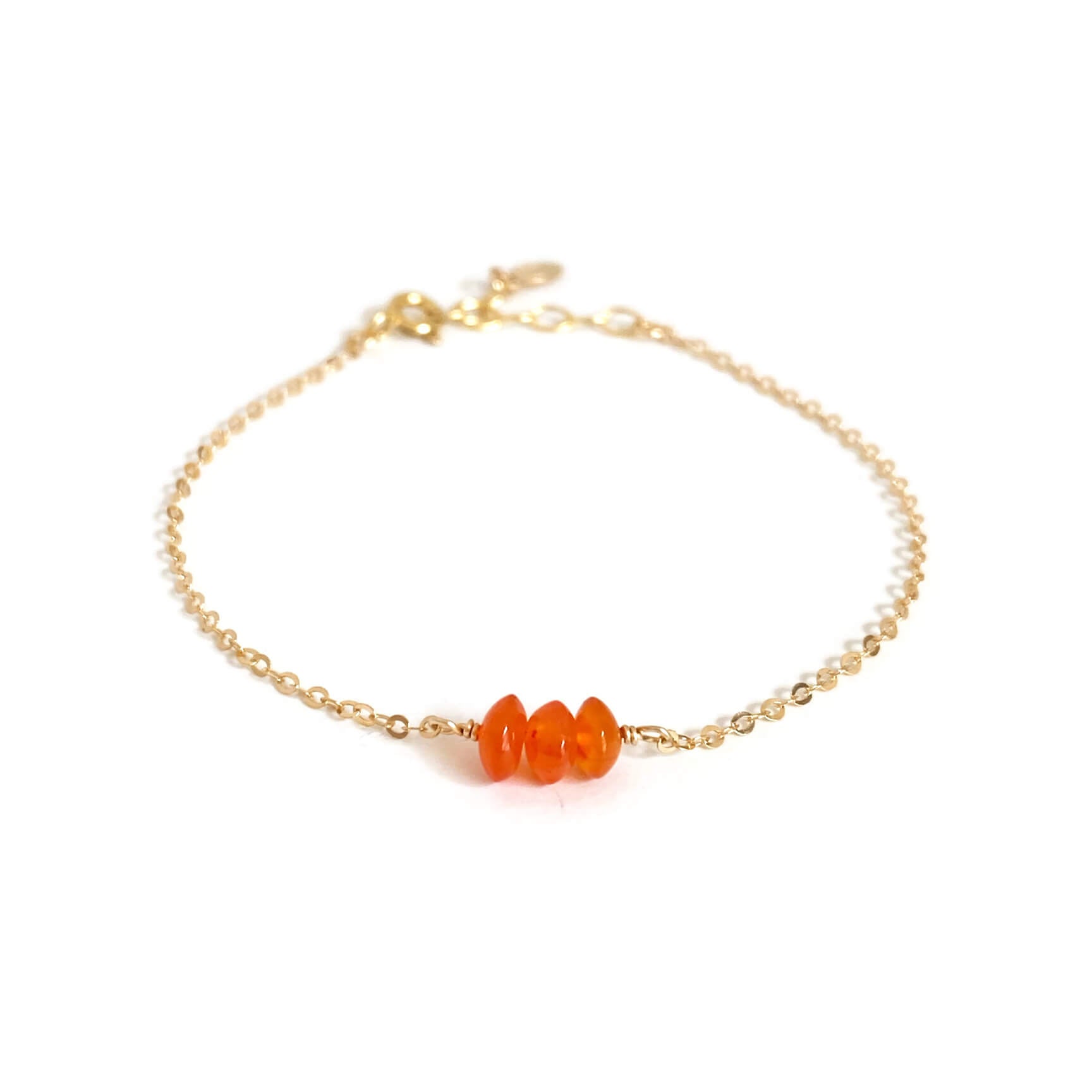 This is a genuine carnelian bracelet that is made of gold filled chain. It's dainty and adjustable.  