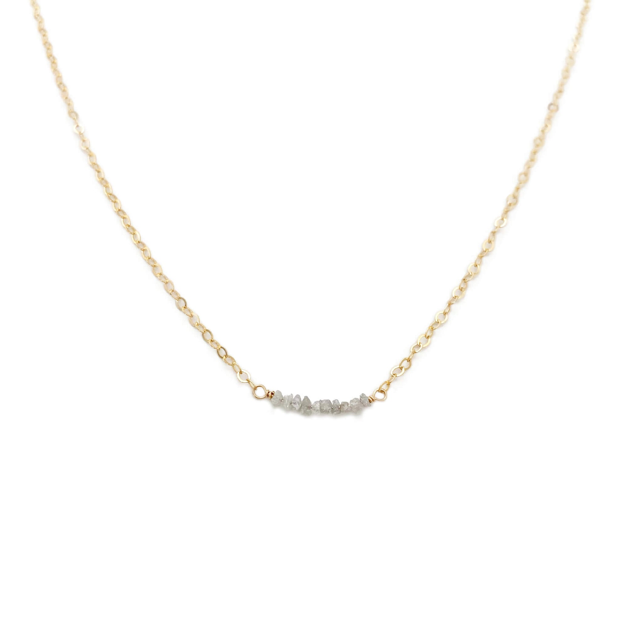 The dainty diamond bead necklace is made with hand selected raw diamonds and 14k gold chain.  We can also custom make it in sterling silver or gold filled chain.