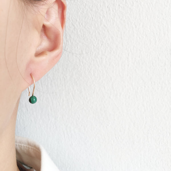 This dainty drop earings are made of Malachite and gold filled wire.