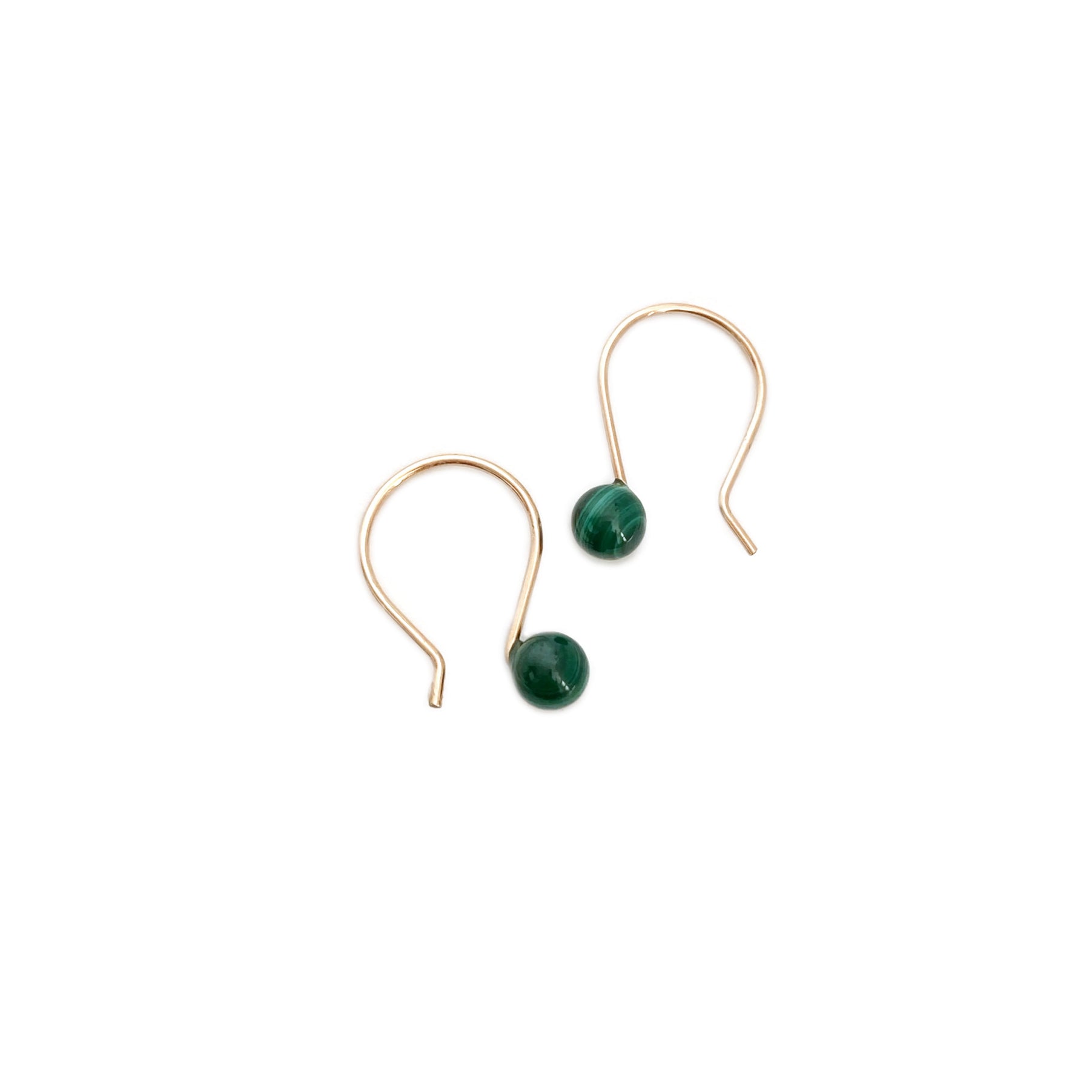 Malachite earrings are made in San Francisco.