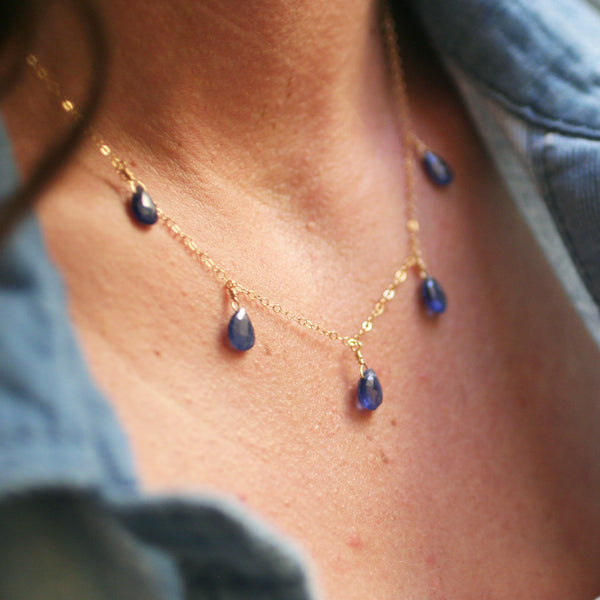 This dangling sapphire necklace is made of 14k gold and genuine sapphire gemstones. 