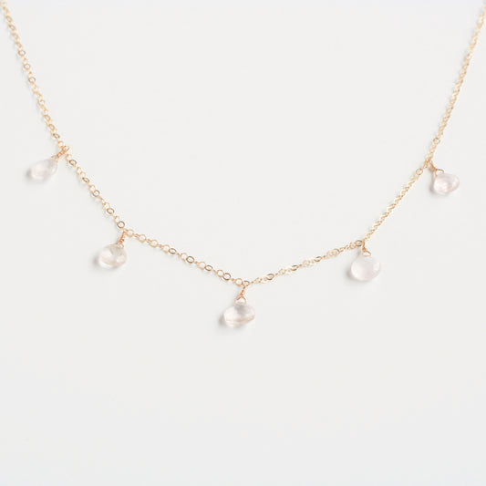 This rose quartz necklace is a dangling necklace. It's made of real rose quartz crystal with 14k gold chain.