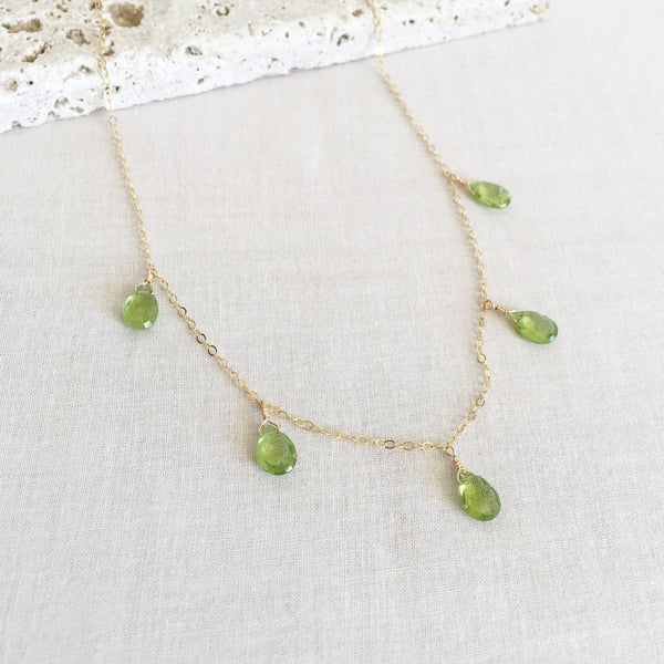 This peridot necklace is made of 14k gold chain with 5 genuine peridot gemstone crystal. 