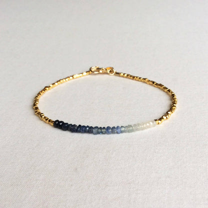 this ombre sapphire bracelet exudes a timeless look.  The bracelet is made with hand-selected sapphires that have different shades of blue – from nearly white to deep navy blue. 