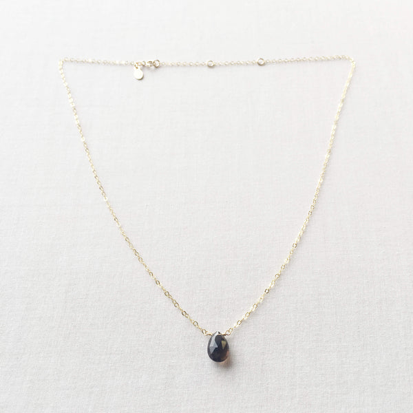 This healing smoky quartz necklace features a single grey gemstone attached to a 14k gold, gold fill or sterling silver chain.