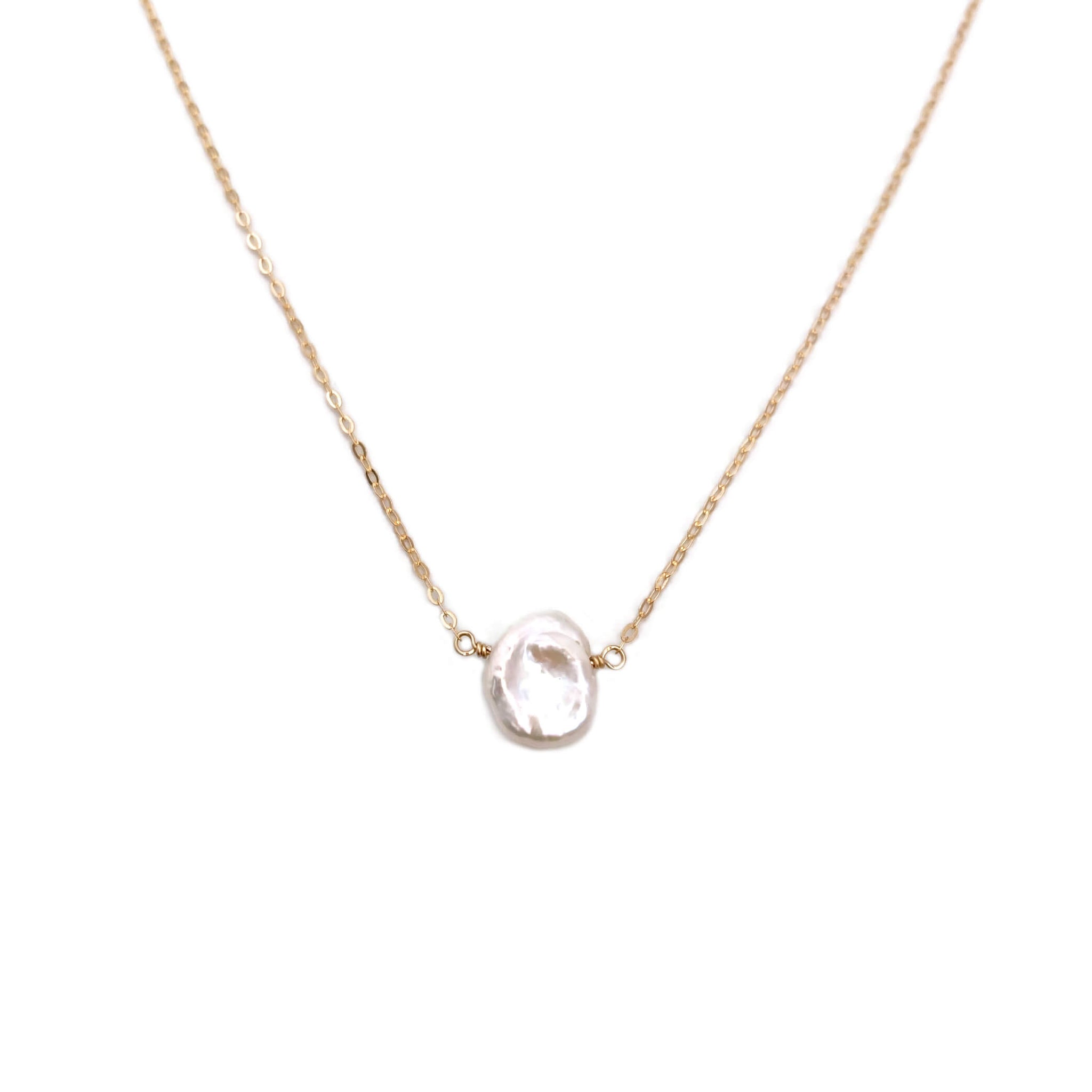 This real pearl necklace is made with a single genuine freshwater keshi pearl with adjustable chain.