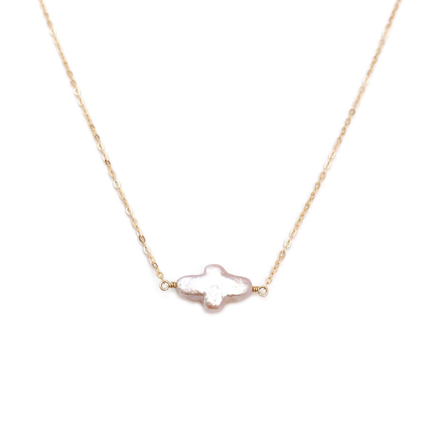The sideway cross necklace is simple yet elegant, made using hand selected fresh water pearl.  