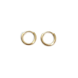 Simple gold hoop earrings are made in 14k solid gold.  They are 12mm in diameter. 