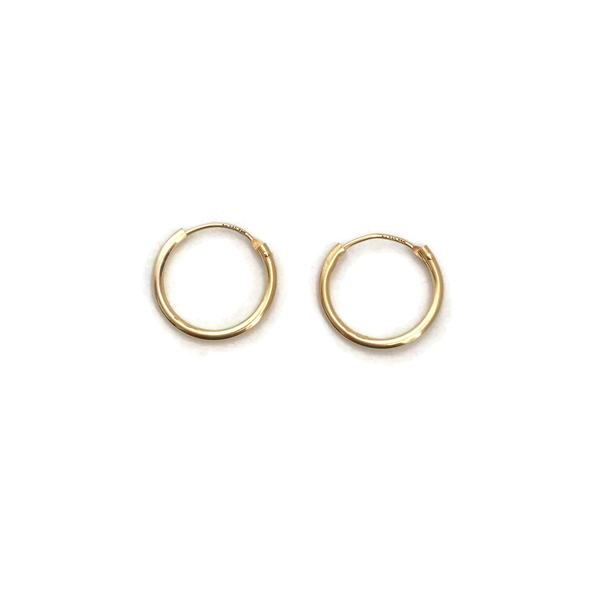 These are 14k solid gold hoop earrings. They are as light as feather and great to wear them 24/7