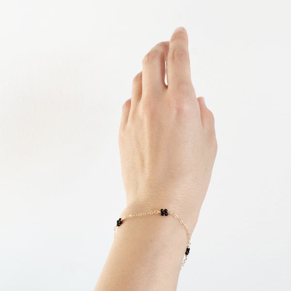 This dainty gold bracelet is made of black onyx beads with 14k gold chain. Black Onyx is the gemstone for protection and grounding your energy. 