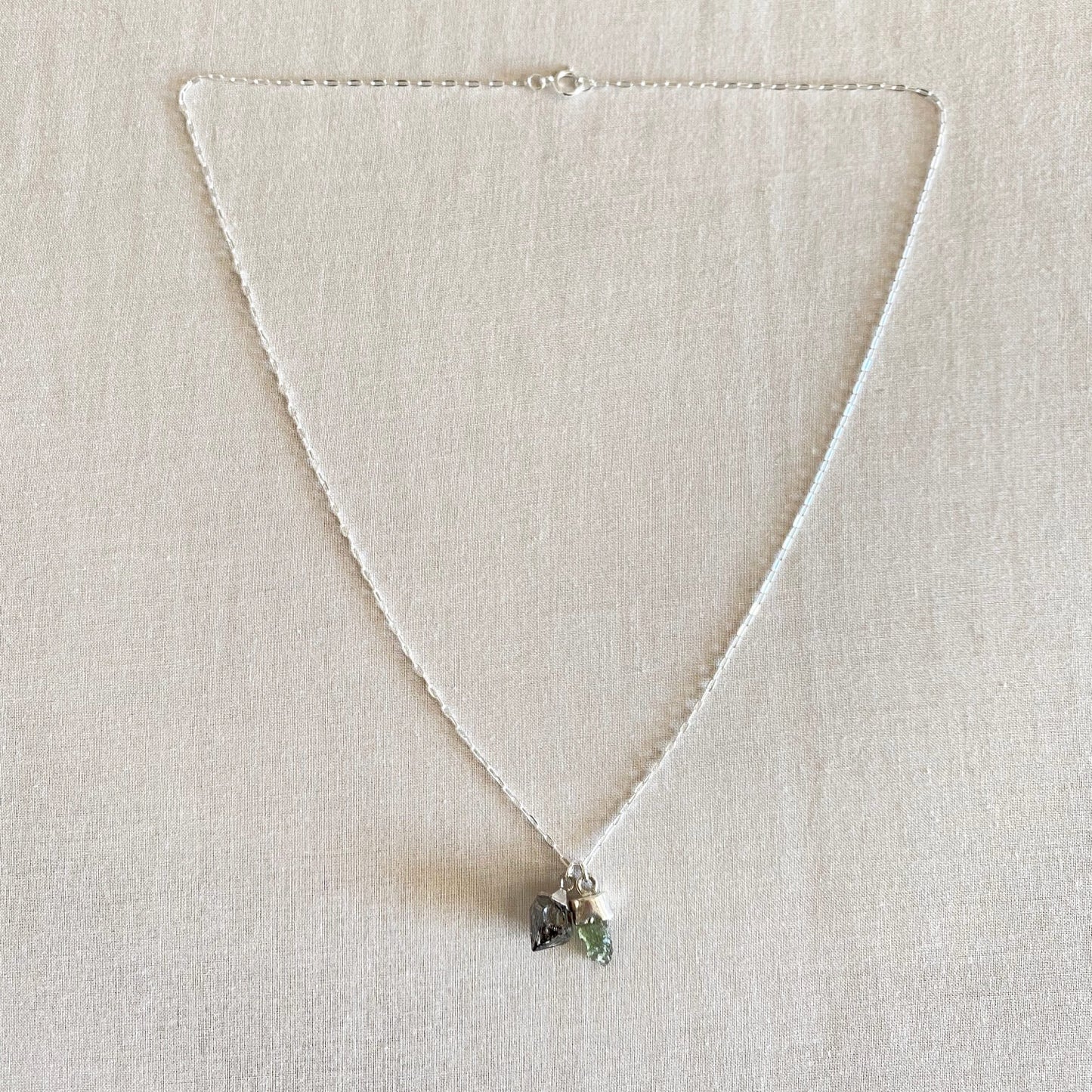 Moldavite and Herkimer diamond necklace is made of sterling silver. 