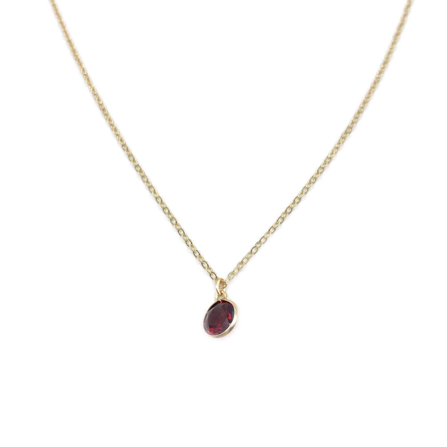 This is a 14k garnet necklace that is made of 14k bezel set garnet with 14k gold chain.