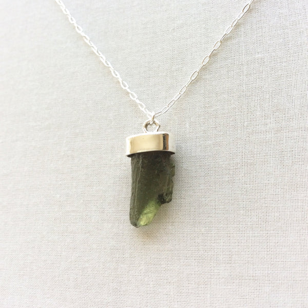 This moldavite necklace is made from a single genuine Czech moldavite gemstone.  We hand make the green gemstone necklace with a sterling silver chain.