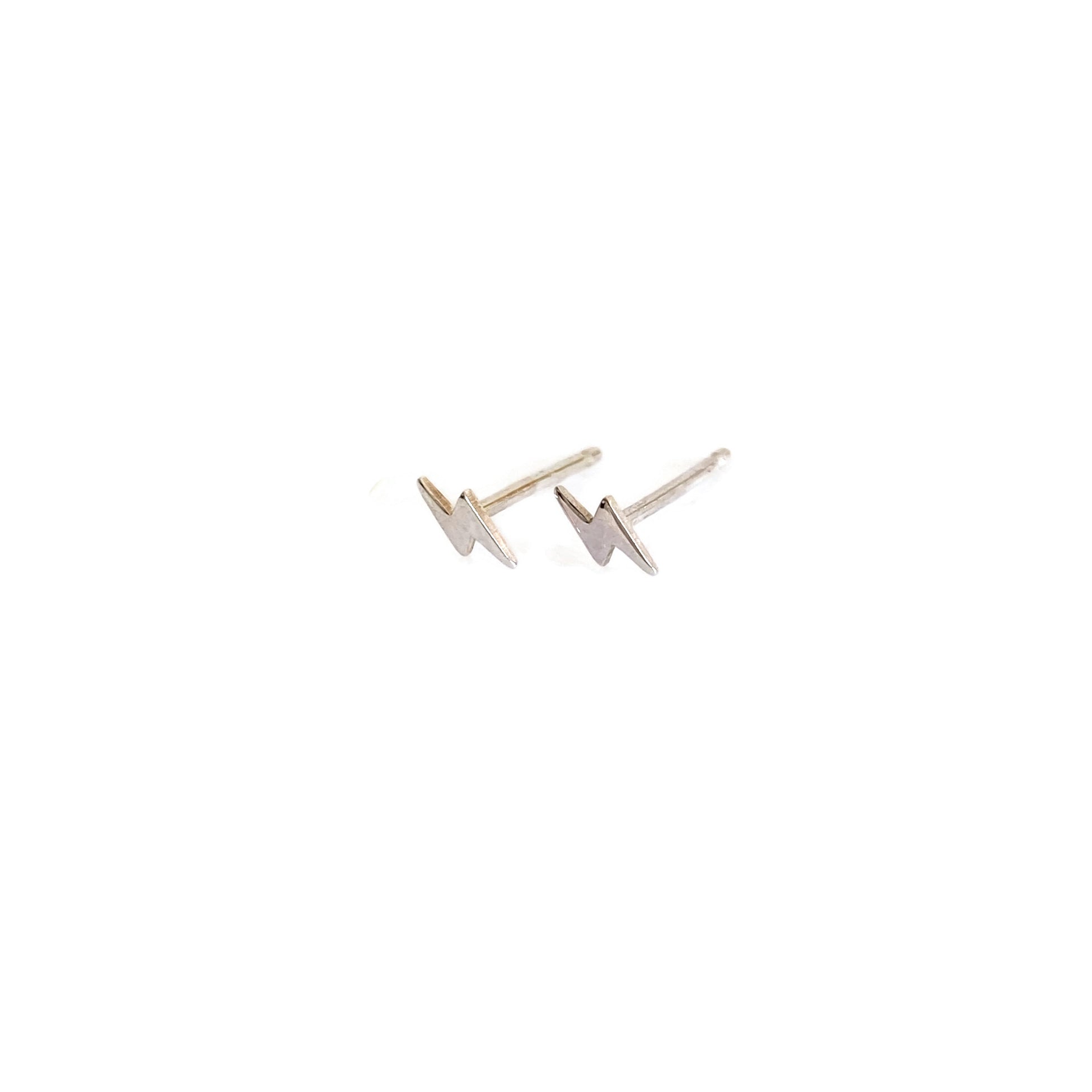 sterling silver tiny lightening bolt stud earrings are small and great for cartilage piercing.