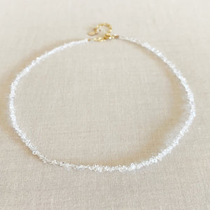 This is a herkimer diamond choker necklace that is adjustable and made of 14k gold.
